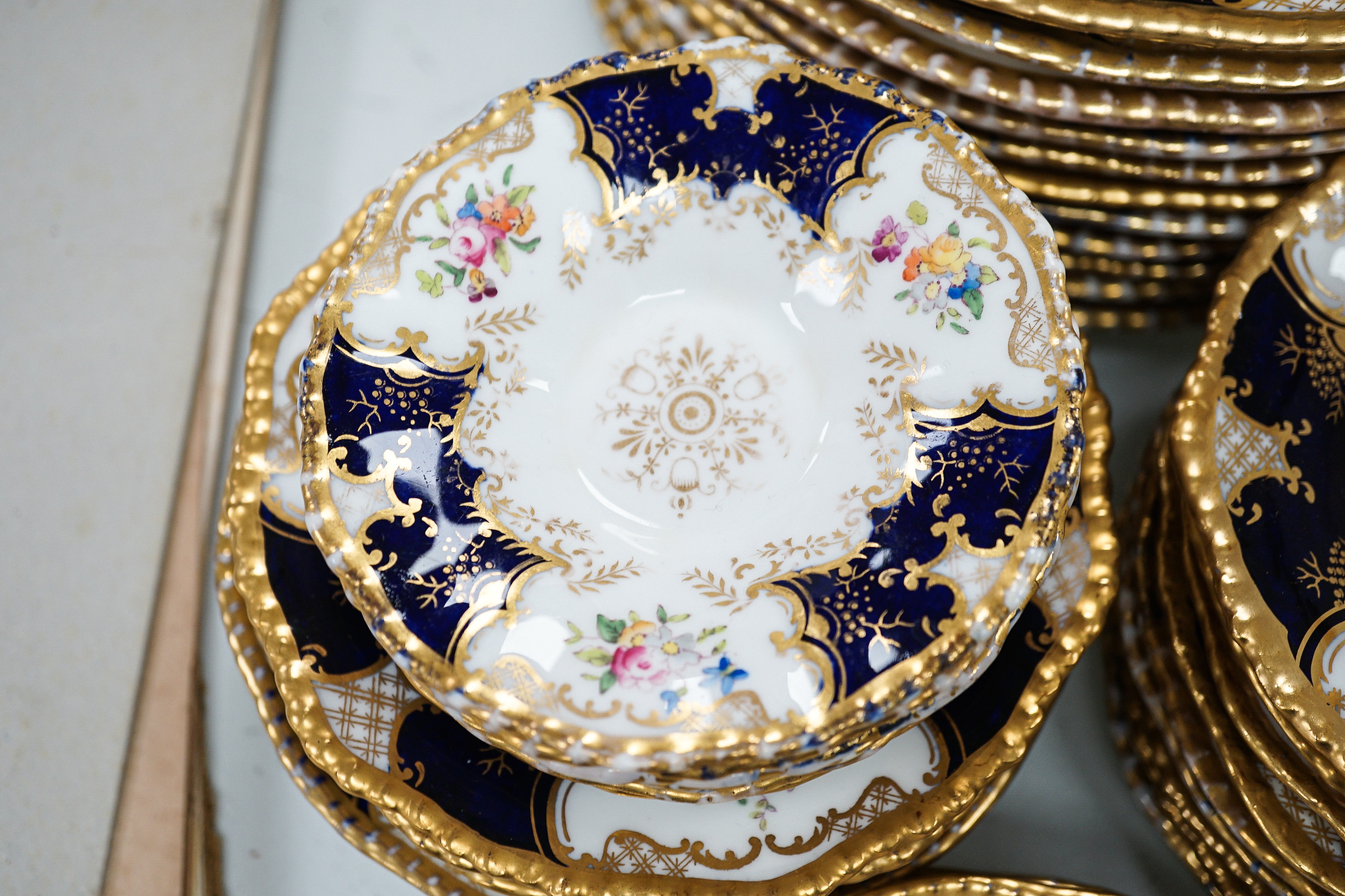 A large set of Coalport blue ground tea and coffee service and similar green ground tea wares